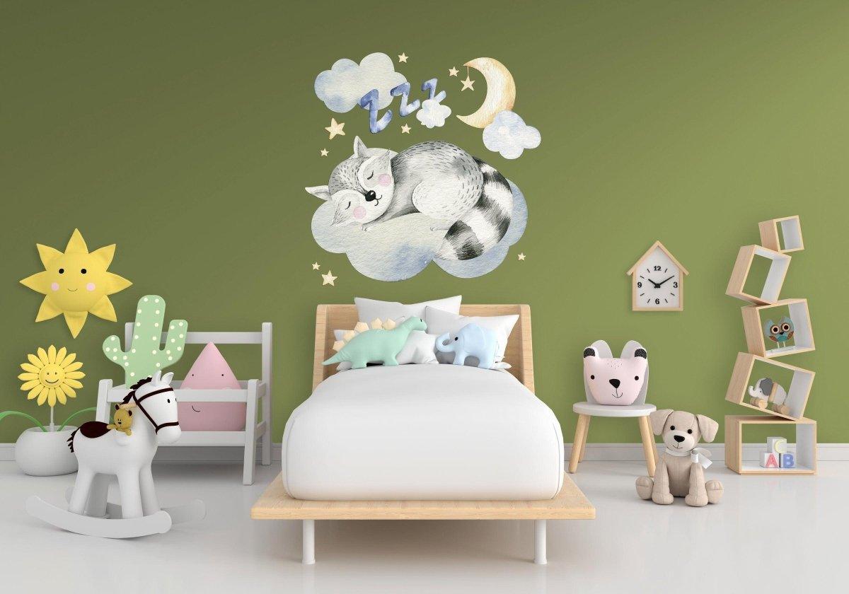 Dreamy animal wall decal featuring a sleeping raccoon with clouds and moon in a baby nursery.