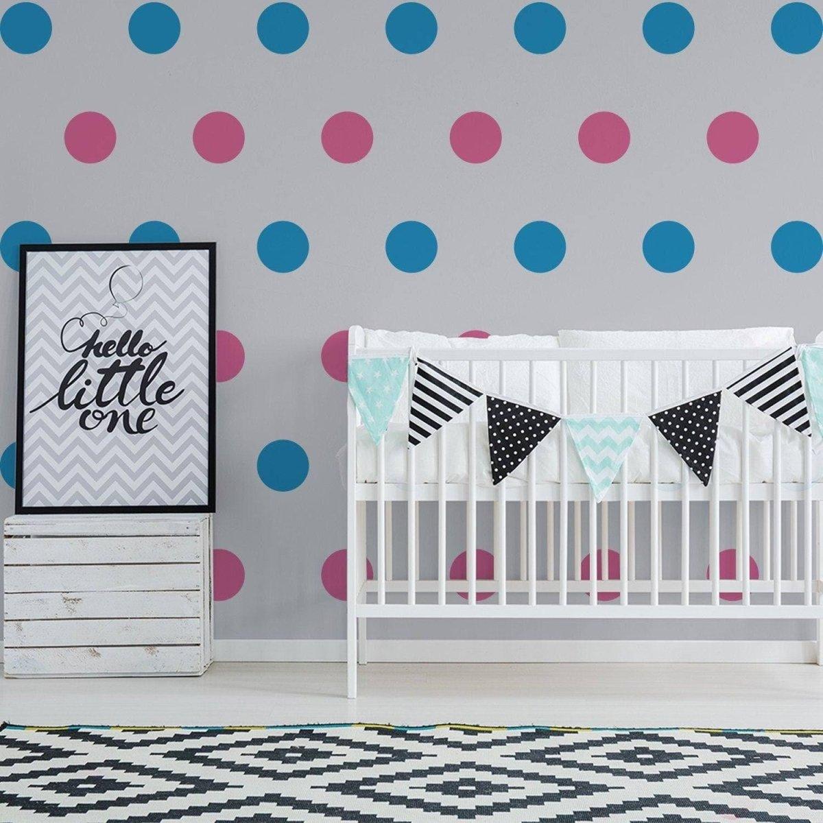 Nursery with colorful wall decals, crib, and decorative banner for a stylish baby room.