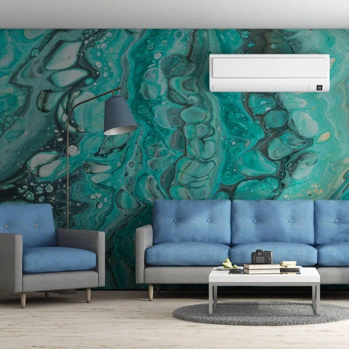 Living room featuring luxurious self-adhesive marble wallpaper, blue couches, and modern decor for a stylish ambiance.