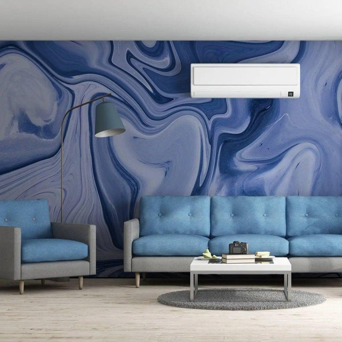 Living room featuring self-stick marble wall film in blue hues, light blue sofas, and modern decor.