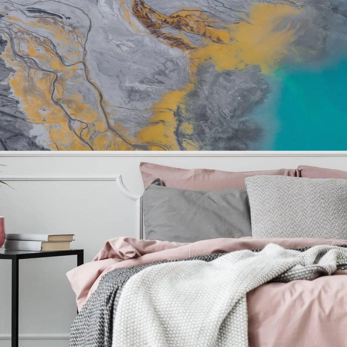 Elegant self-stick marble wall film in shades of grey and gold, enhancing a cozy bedroom decor.