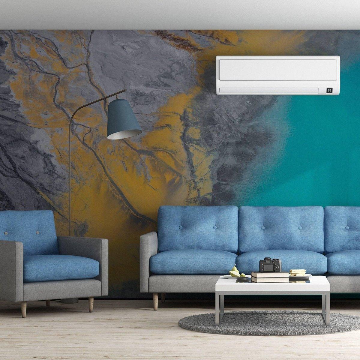 Chic living room featuring self-stick marble wall film with stylish blue sofas and modern decor.