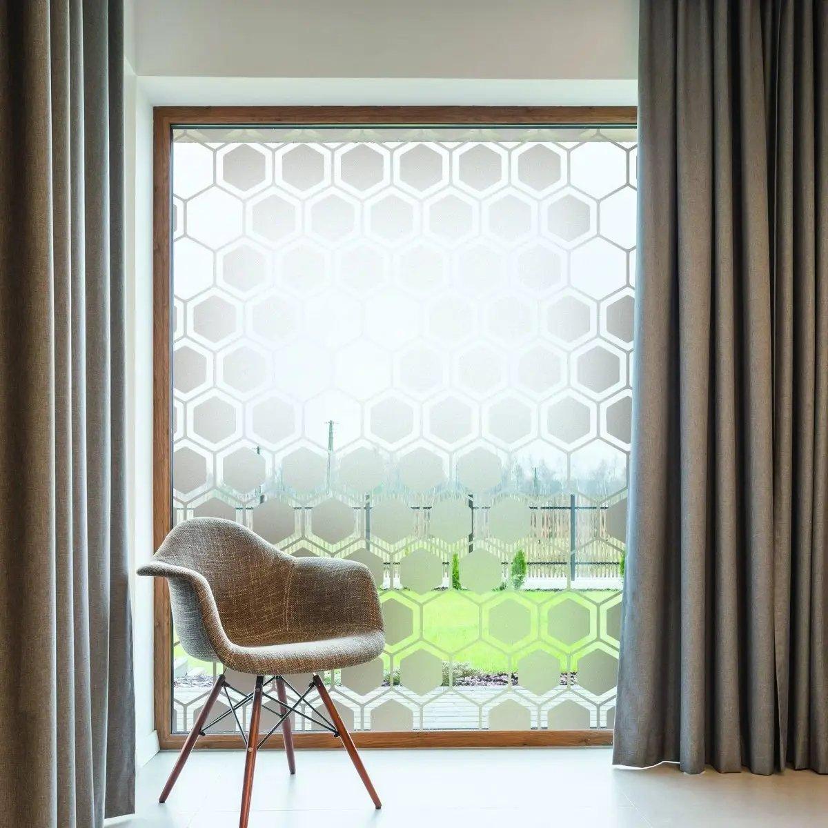 Frosted window film with hexagonal pattern enhancing privacy and light in a modern room.