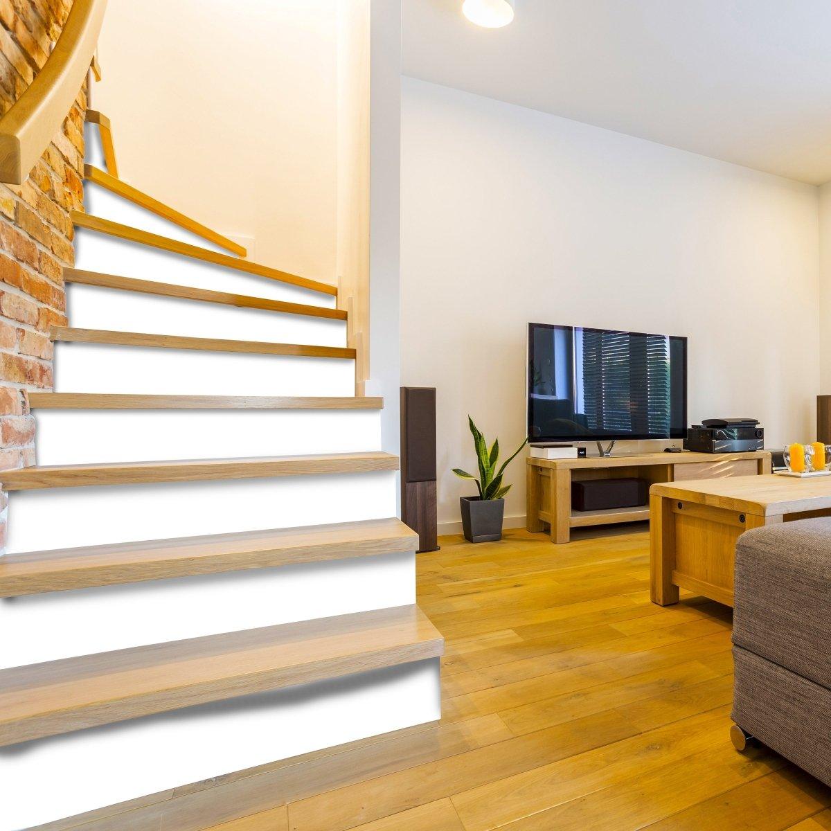 Elegant staircase featuring white self-adhesive risers, enhancing home decor with style and sophistication.