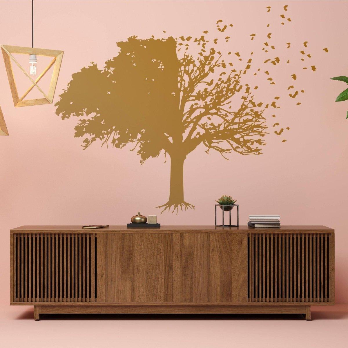 Chic wall sticker of a sophisticated tree silhouette with leaves against a pink wall, adding elegance to living space.