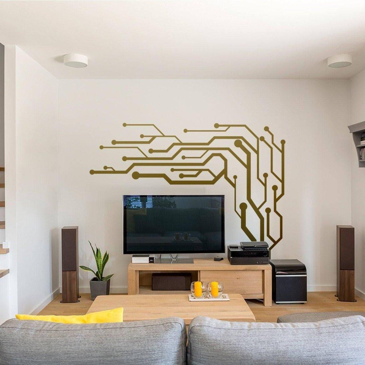 Stylish wall art decals featuring a modern circuit design above a TV in a contemporary living room.