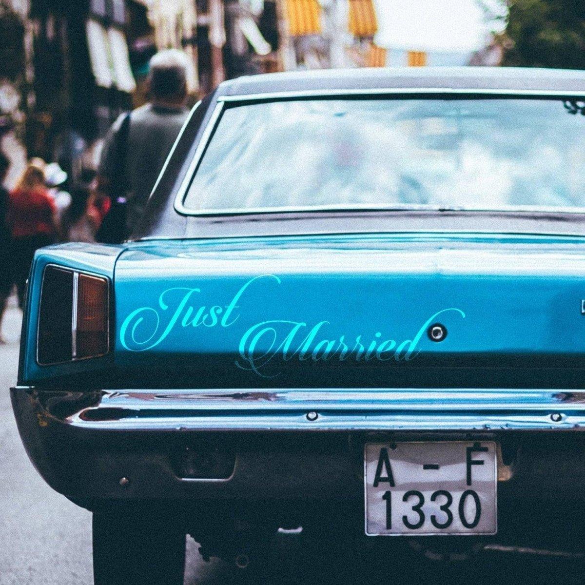 Just Married car sticker on a blue vehicle, perfect for wedding day decoration and celebrations.