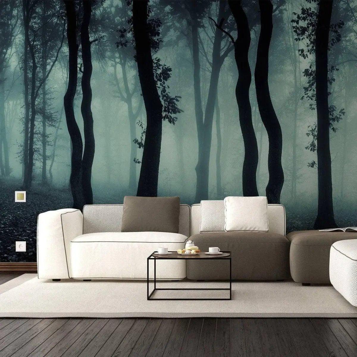 Foggy forest mural wallpaper behind modern cozy living room furniture, creating a serene and enchanting ambiance.