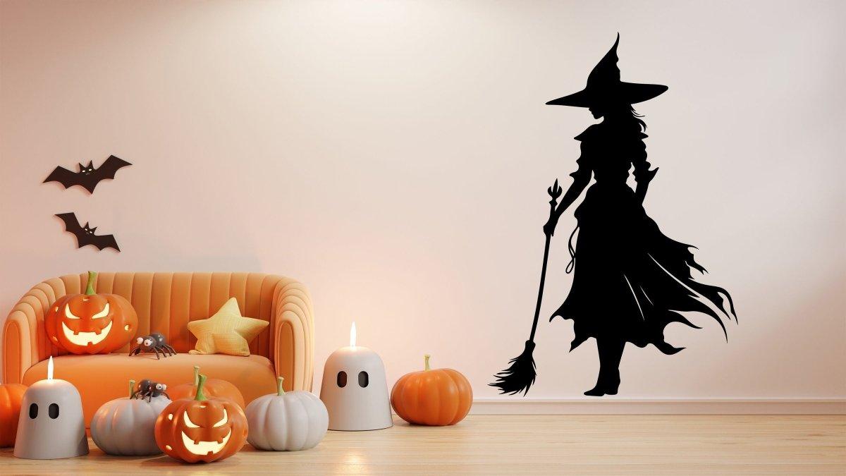 Witch silhouette decal on wall with pumpkins and Halloween decor, perfect for seasonal decoration.