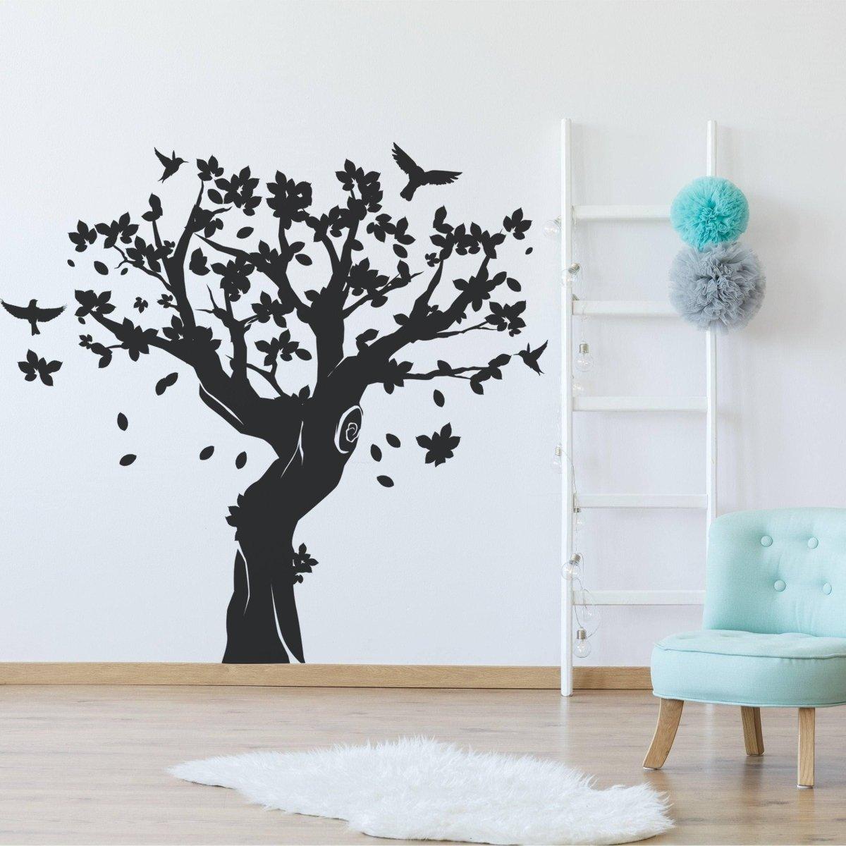 Contemporary tree wall art sticker in a nursery, featuring birds and flowers, perfect for kids' room decor.