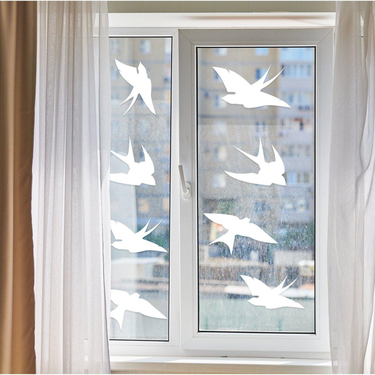 Bird safety window decals by FeatherGuard displayed on a window, enhancing home aesthetics and protecting wildlife.