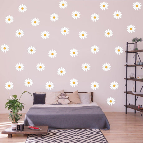 Bright and cheerful daisy wall decals adding floral decor to a cozy bedroom with a stylish bed and bookshelf.