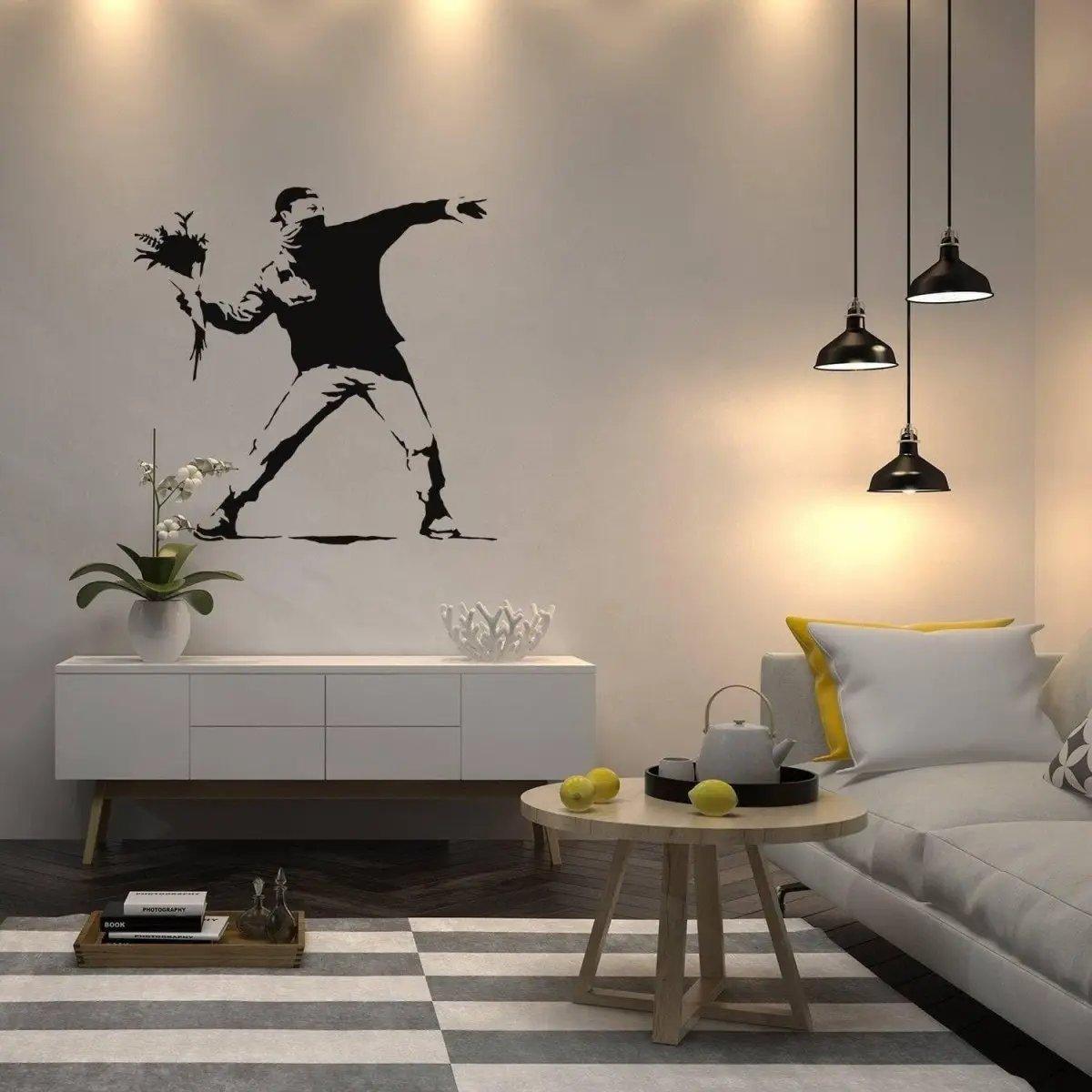 Artistic wall decal featuring a figure throwing flowers in a modern living space with stylish decor.