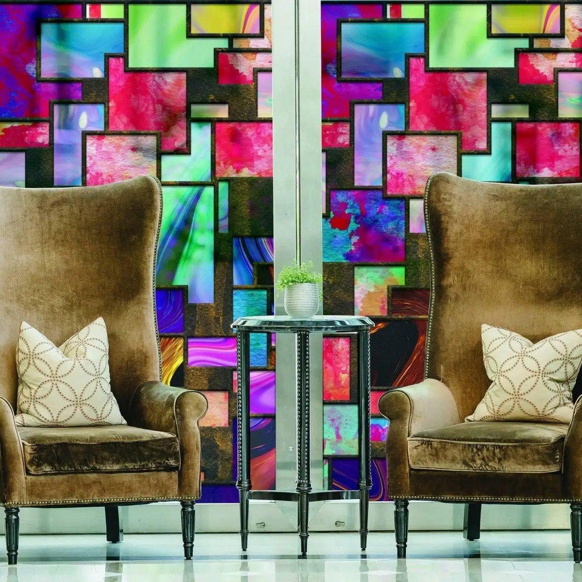 Elegant frosted privacy window film featuring colorful abstract design, enhancing glass panels in a stylish living space.