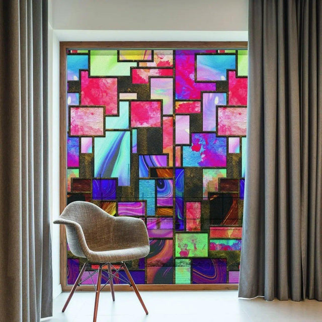 Vibrant frosted window film with colorful geometric patterns transforming a modern interior space.