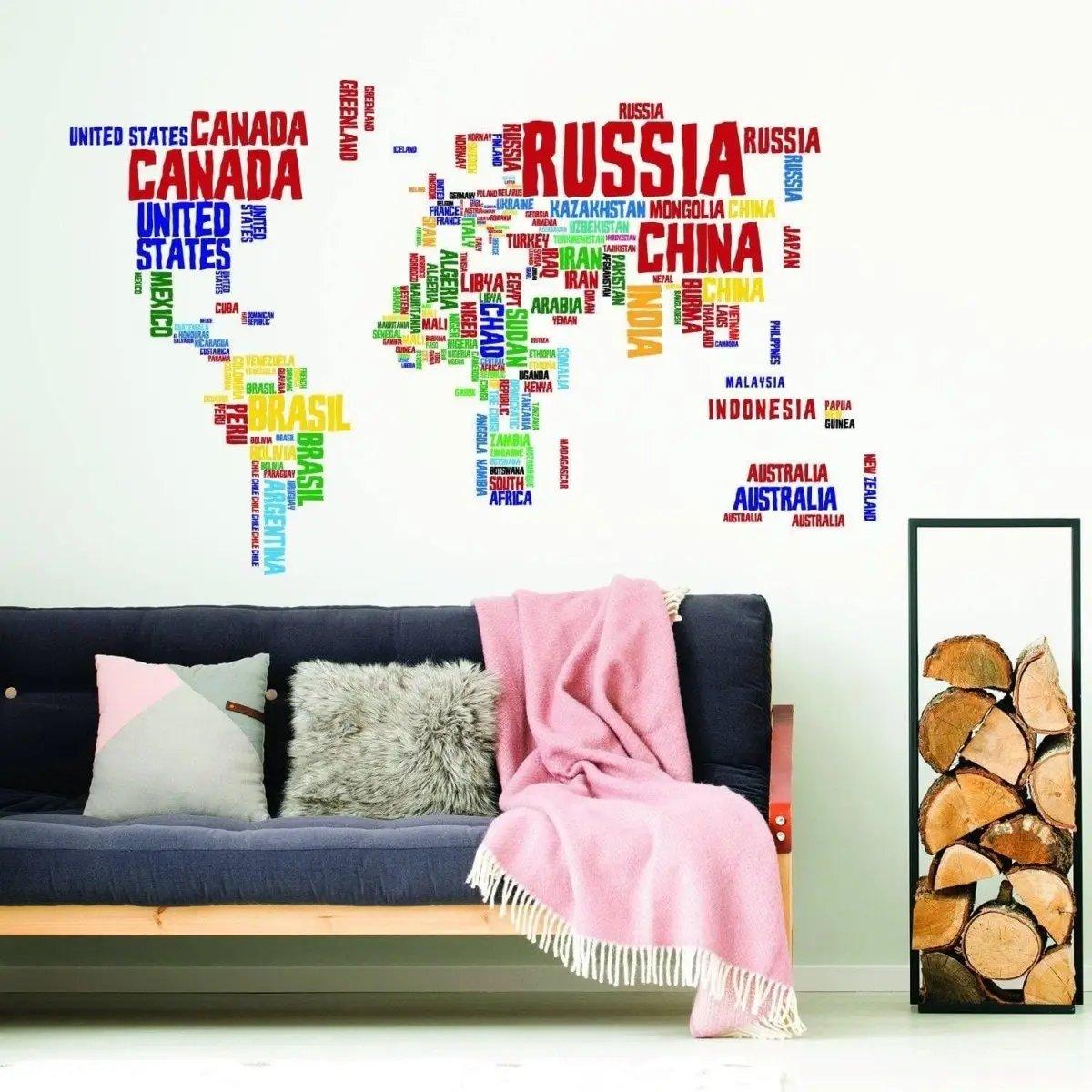 Colorful world map vinyl wall decal with country names, enhancing modern home decor in a cozy living room.