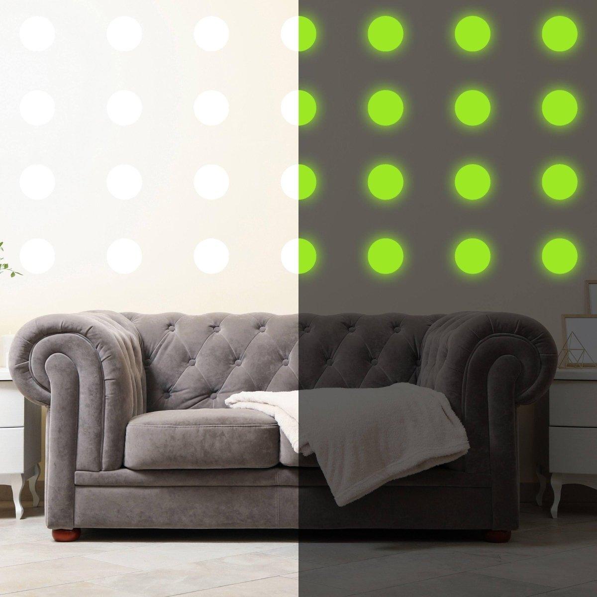 Glow in the dark wall stickers on a grey couch, showcasing illuminated dots versus unlit design.