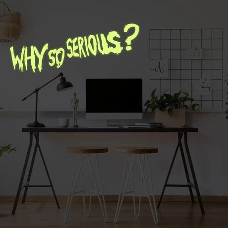 Joker wall art decal with luminous 'Why So Serious?' quote in a stylish office setting.