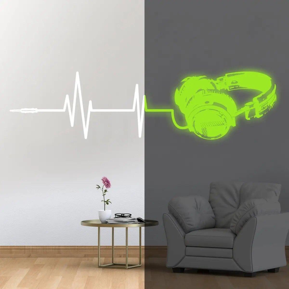 Glow in dark vinyl wall decal of headphones and soundwave design for creative room decor.