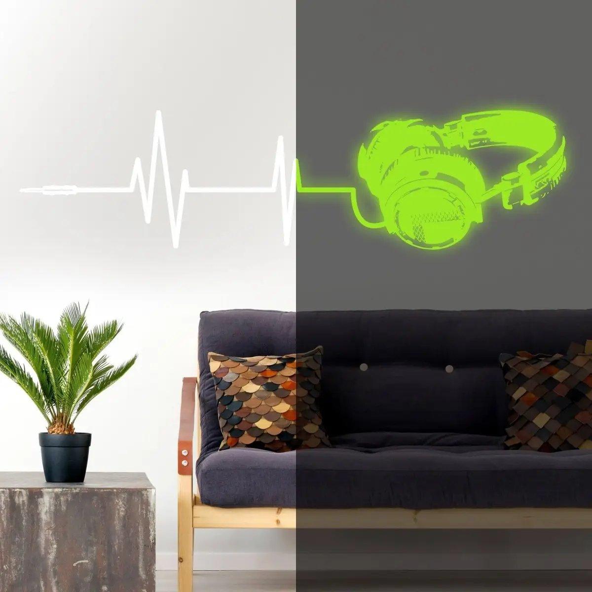 Vinyl wall decal of glowing headphones and sound wave design in modern living room decor.