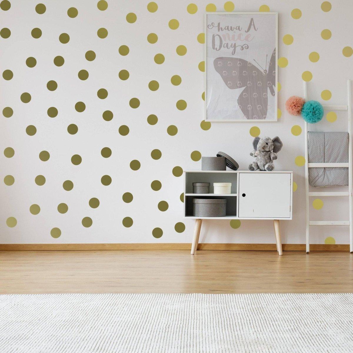 Elegant gold circle wall decals on a stylish white wall, enhancing home decor with a modern touch.