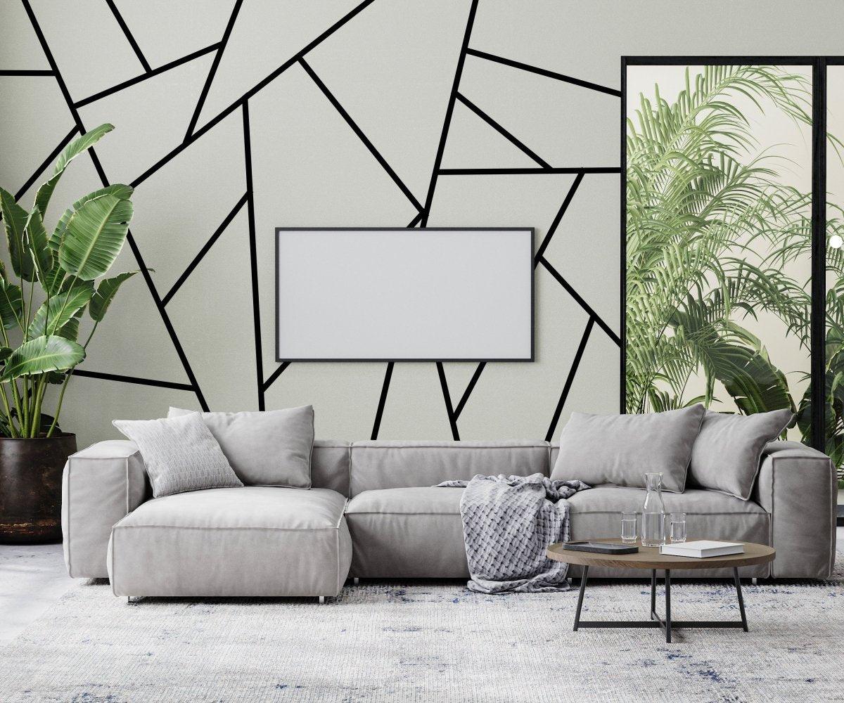 Elegant geometric wall stickers in stylish living room with gray furniture and plants, modern home decor.