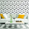 Stylish living room featuring hexagonal honeycomb wall decal, modern furniture, and vibrant cushions.