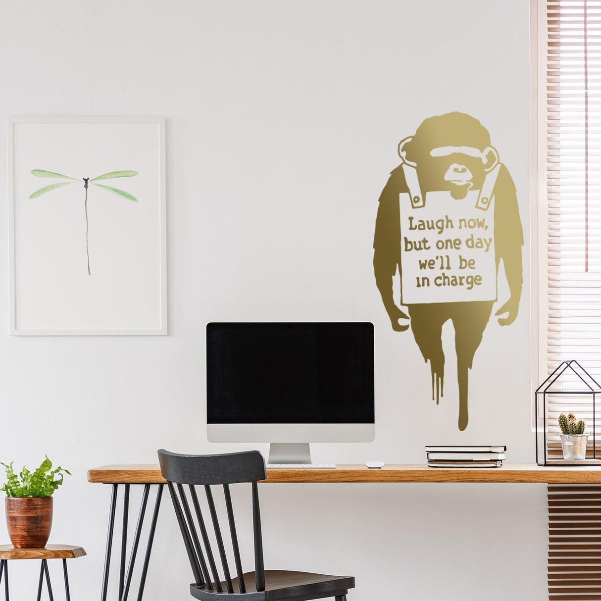 Banksy Monkey wall sticker featuring a monkey with a sign saying 'Laugh now, but one day we'll be in charge'.
