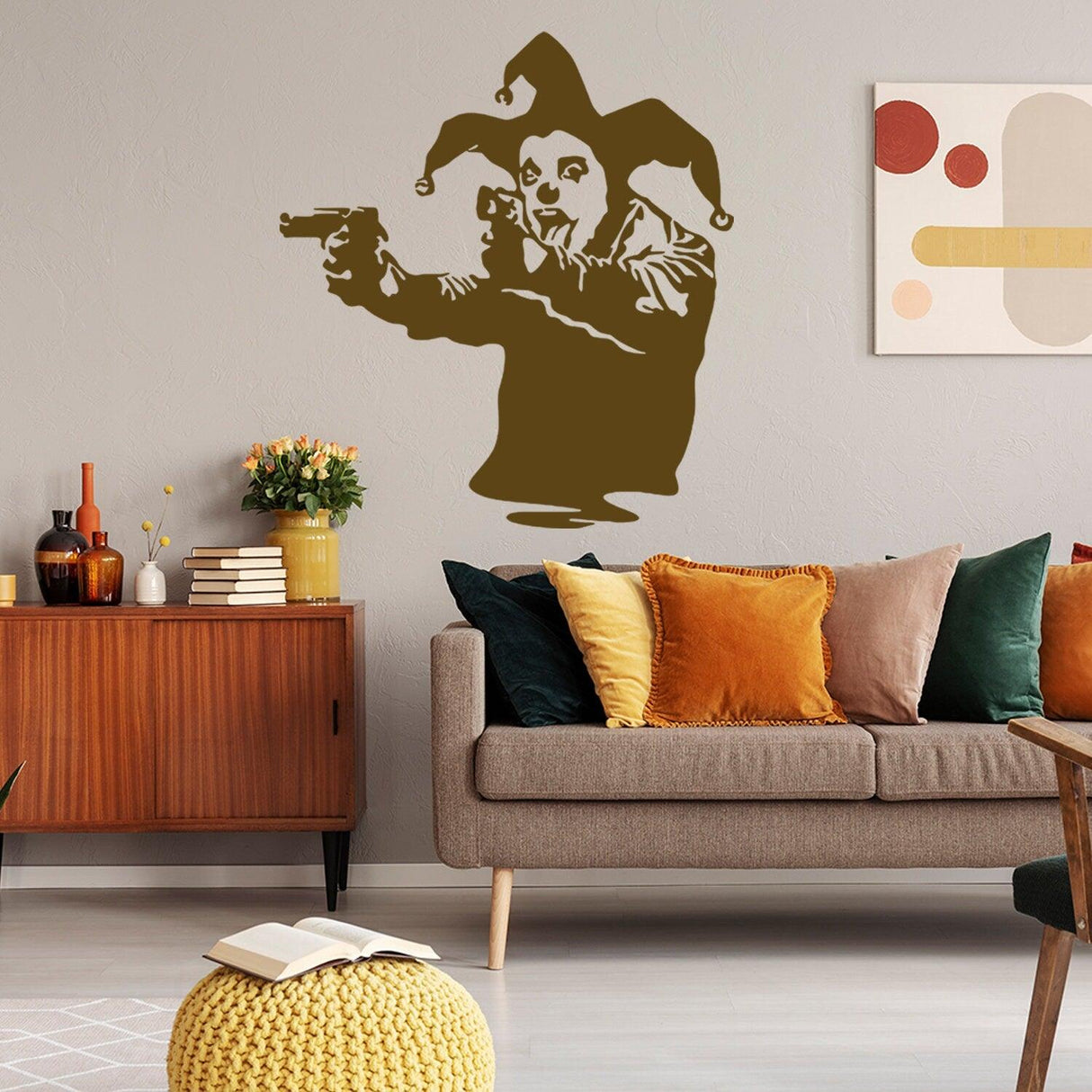 Banksy vinyl wall decal of a Joker clown holding guns, stylish street art decor for modern interiors.