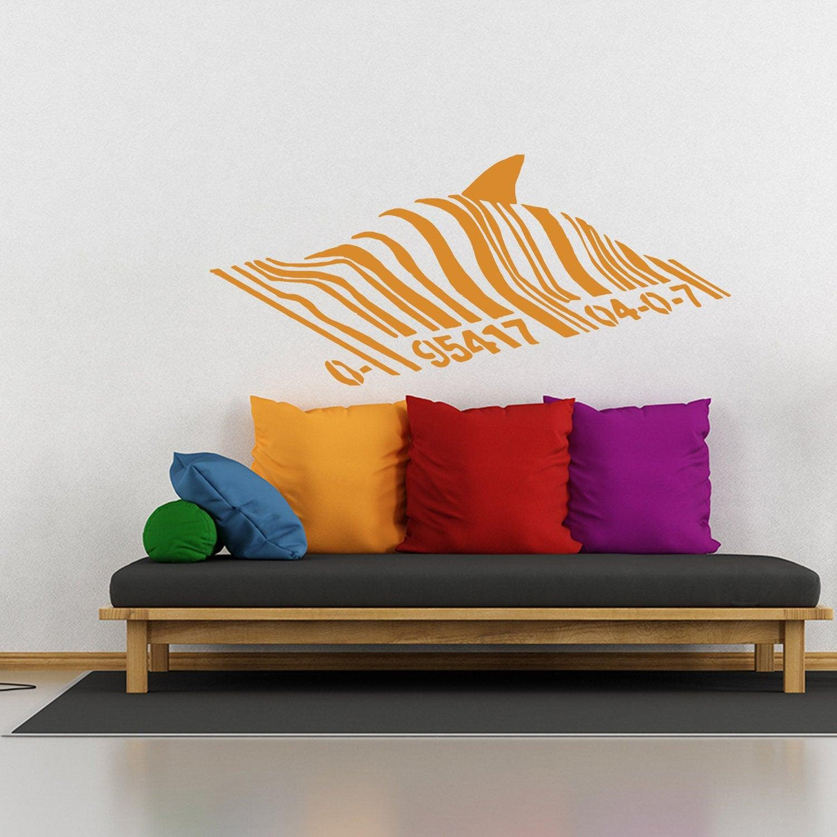Banksy Barcode Shark Wall Sticker on wall above colorful pillows, adding a unique and creative touch to the room.