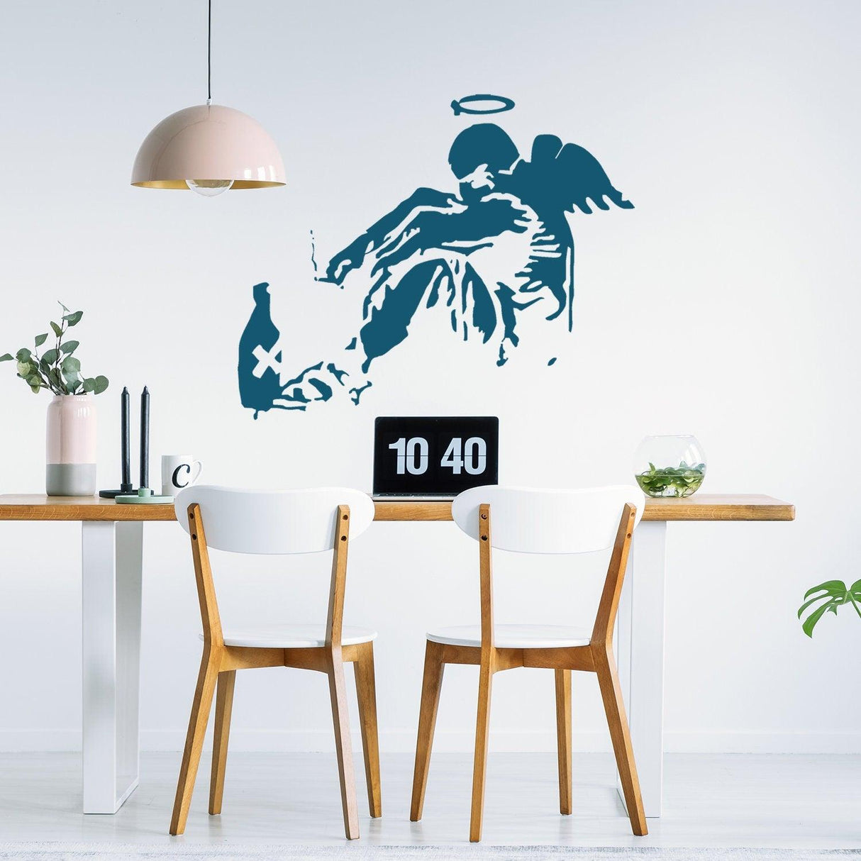 Banksy Fallen Angel wall sticker in a modern dining room, featuring urban art design with wings and halo.