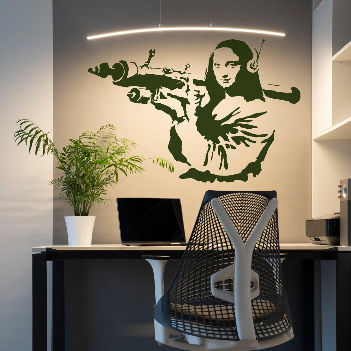 Banksy Mona Lisa wall sticker in a modern workspace, featuring the iconic painting with a contemporary twist.