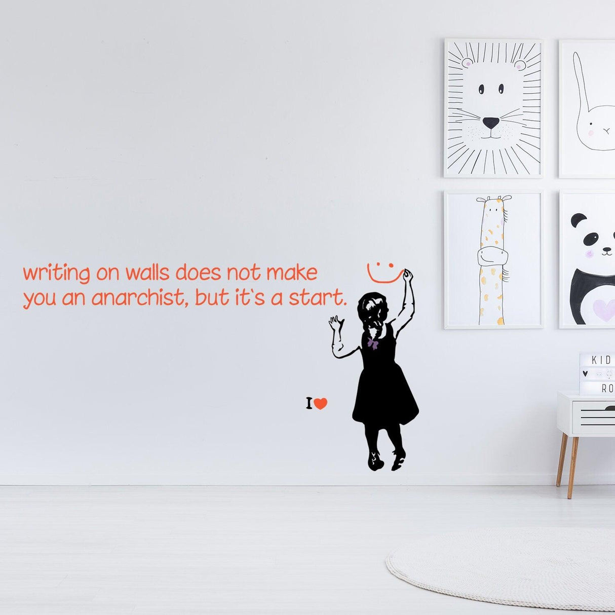 Banksy inspired wall sticker of a girl with text 'writing on walls does not make you an anarchist, but it’s a start'.