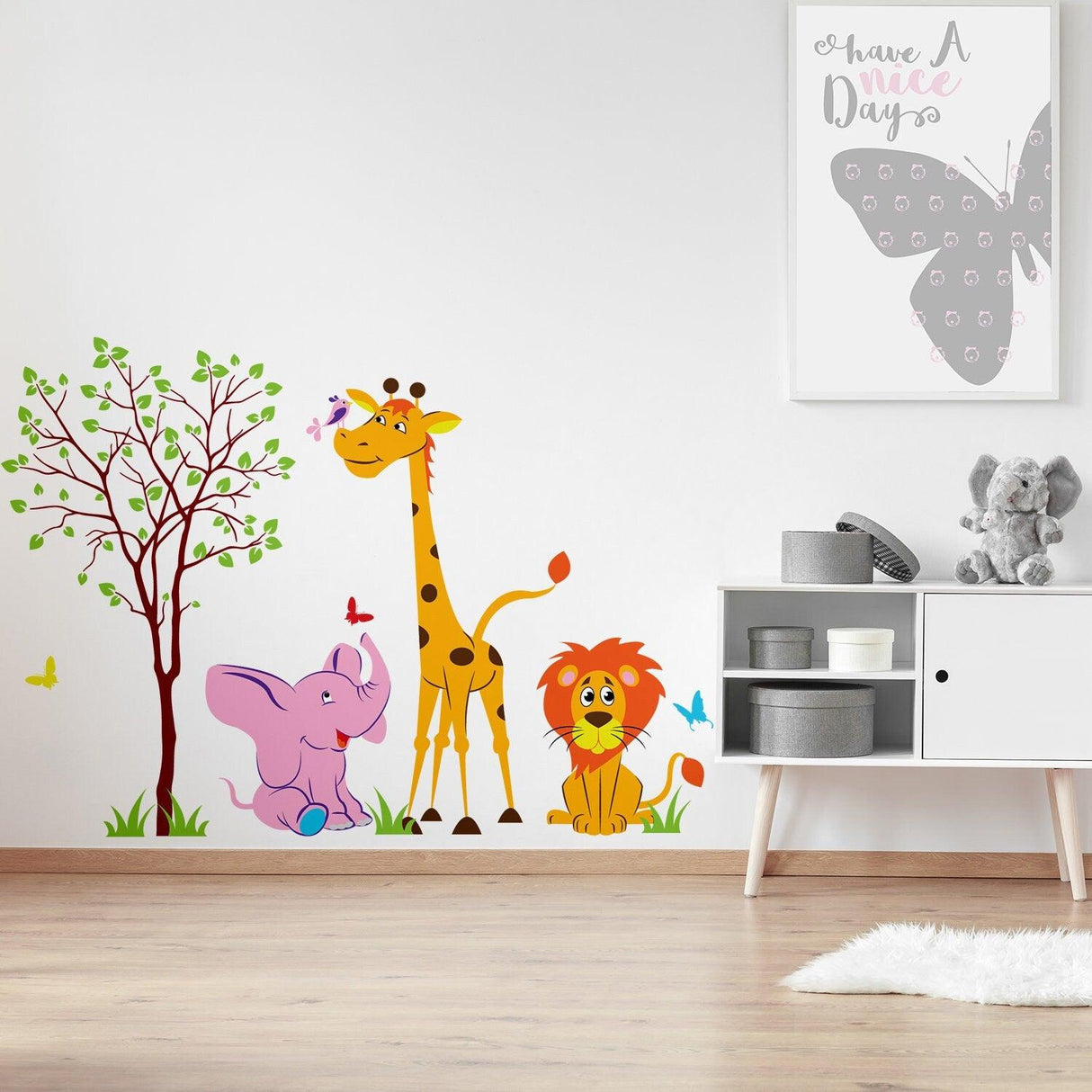 Colorful nursery animal wall decor featuring a giraffe, elephant, and lion with a tree, perfect for kids' rooms.