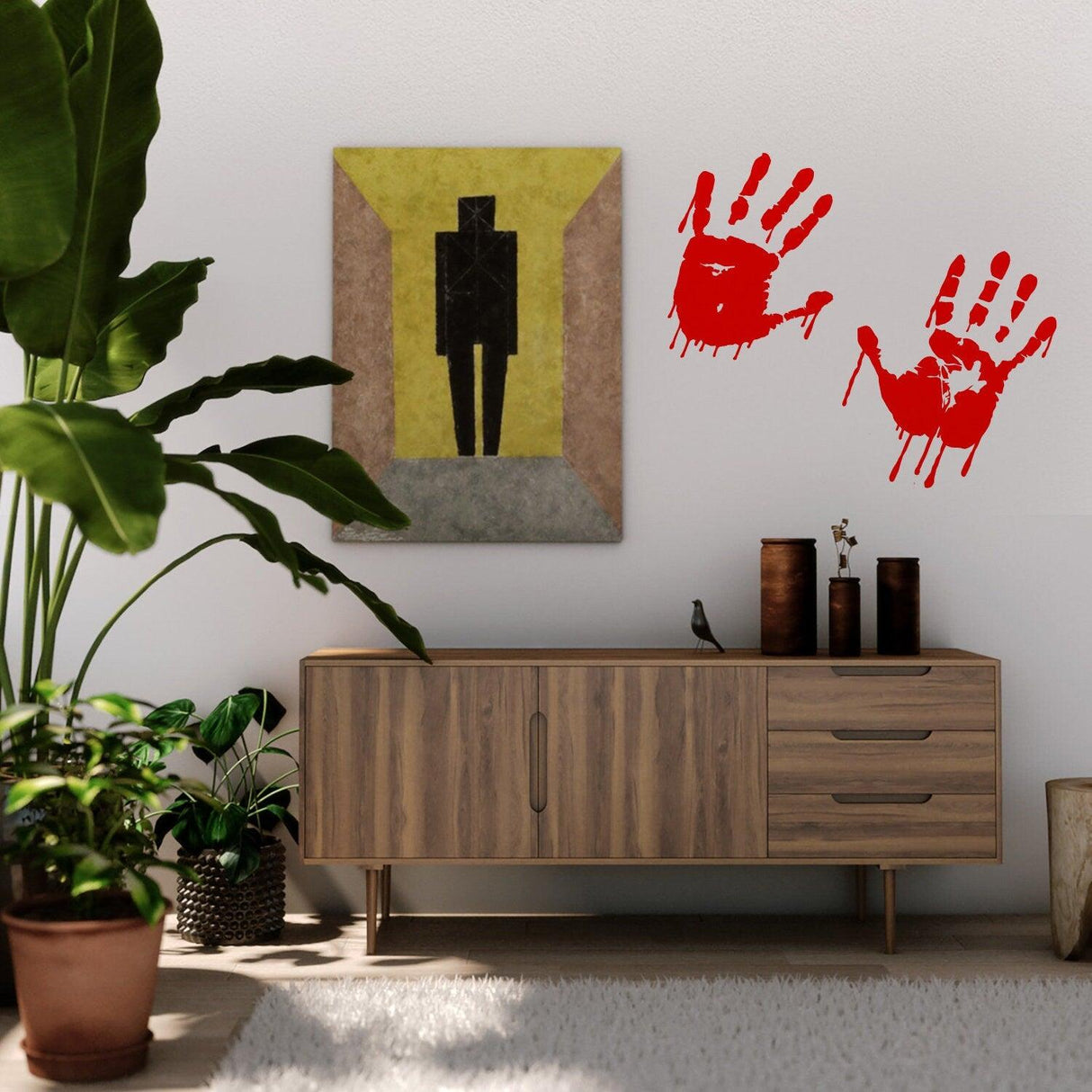 Bloody hands red vinyl sticker on a wall above a wooden furniture with decor, perfect for Halloween decor.