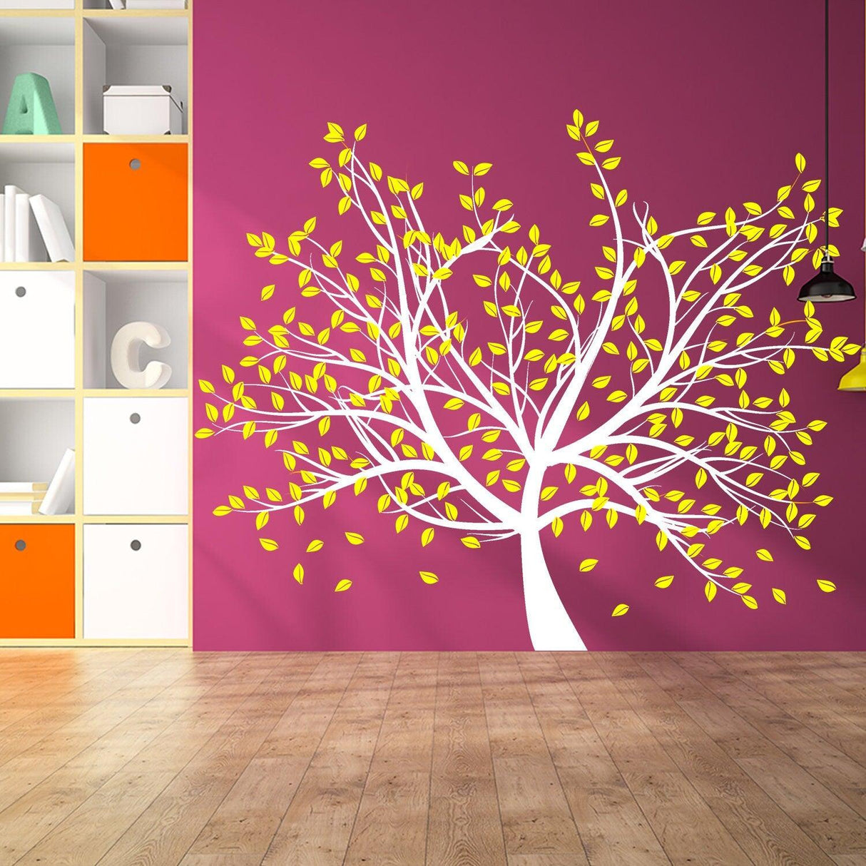 Bright tree wall decal with yellow leaves on a purple wall, creating a vibrant nursery decor.