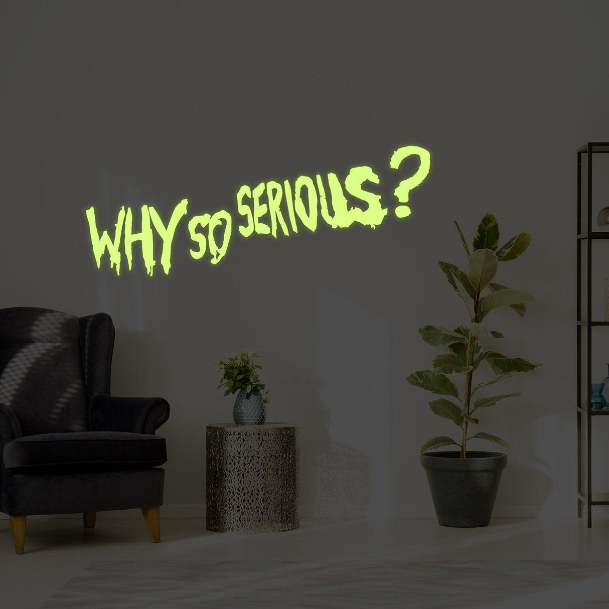 Glow in dark Joker vinyl sticker saying 'Why So Serious?' on wall in stylish living room.
