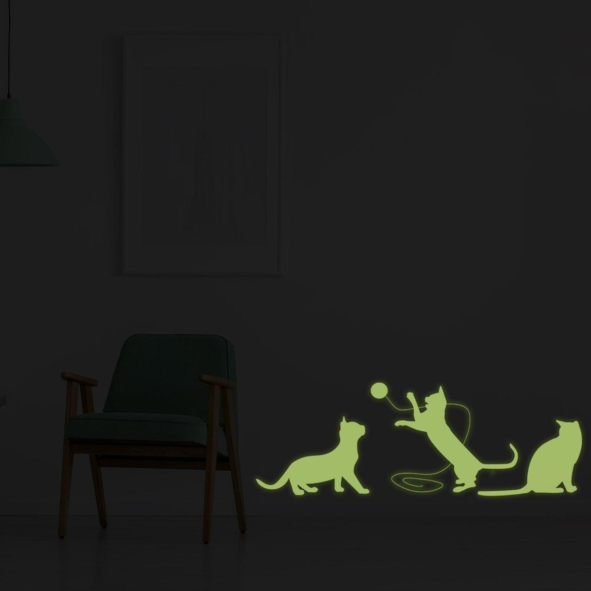 Glow in dark big cat wall sticker featuring playful kittens playing with a ball, illuminating a cozy room.