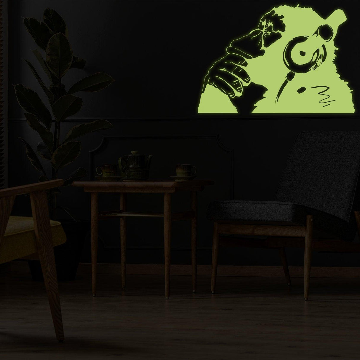 Glowing vinyl wall decal of a monkey with headphones, perfect for adding modern art to any room.