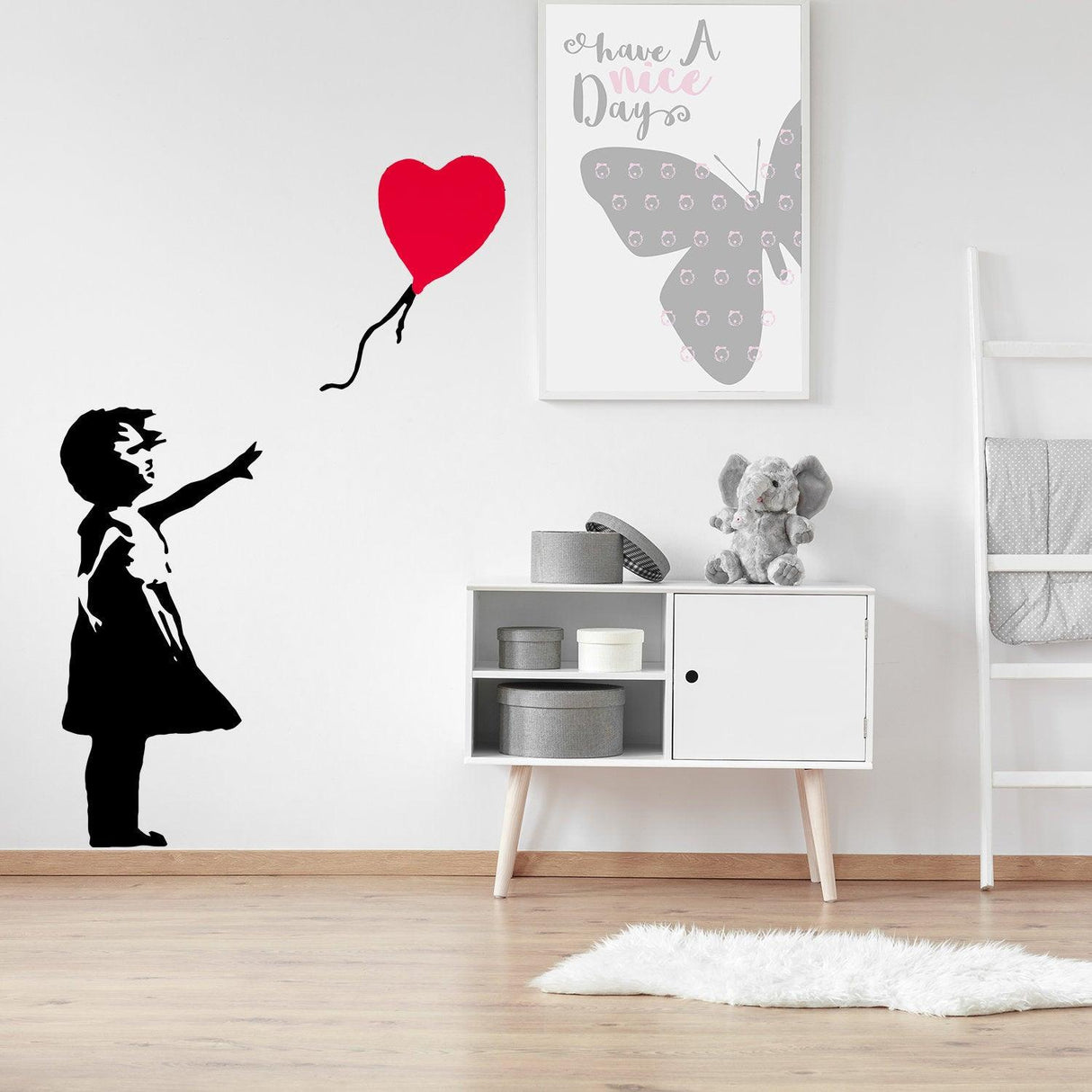 Banksy Girl With Heart Balloon Wall Sticker in modern room with butterfly art and minimalist decor.