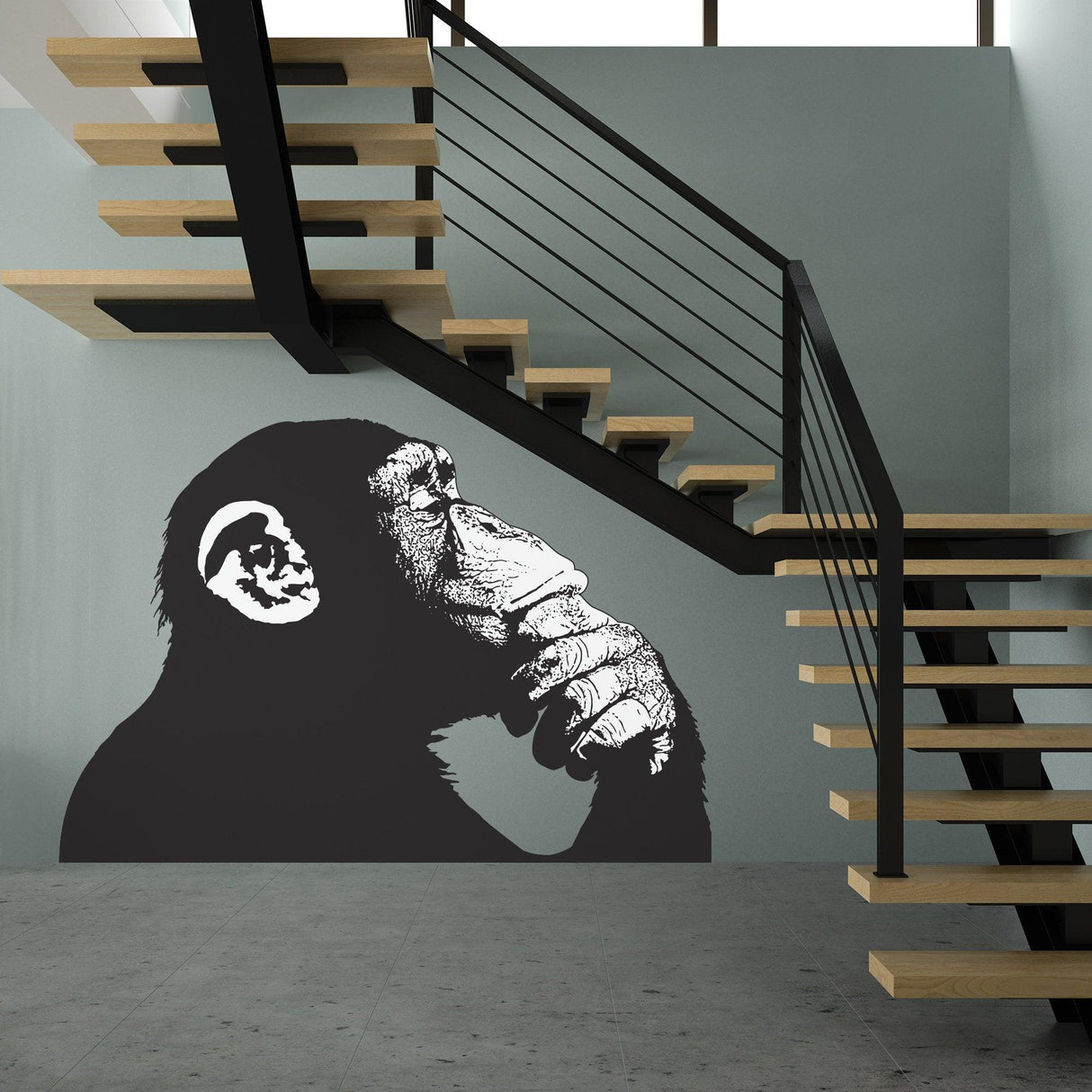 Banksy-inspired Thinking Monkey wall sticker in a modern stairwell, showcasing a contemplative monkey design.