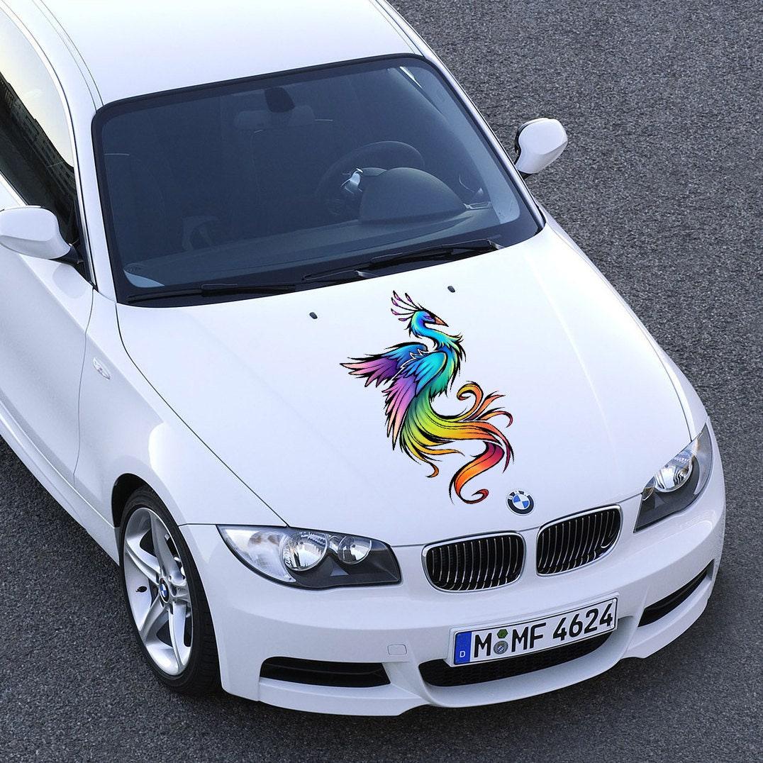 Custom vibrant vinyl sticker design of a colorful phoenix on a white car hood, perfect for truck art.