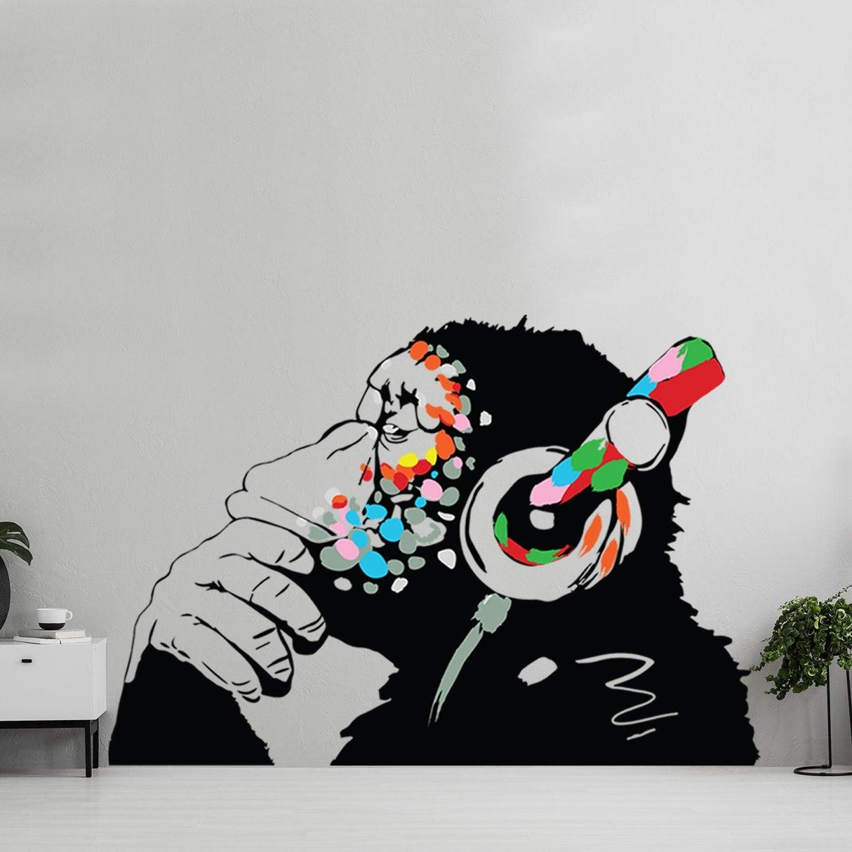 Banksy monkey graffiti wall decal with colorful headphones, perfect for music lovers and urban art enthusiasts.