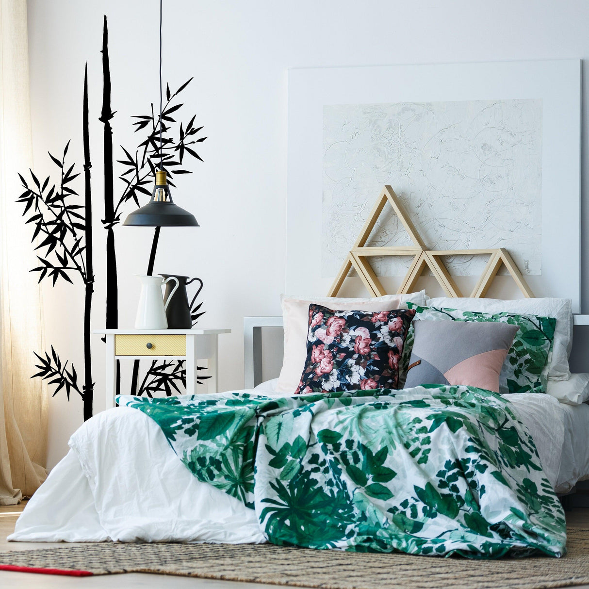 Bamboo wall vinyl sticker in modern bedroom decor with green and floral bedding.