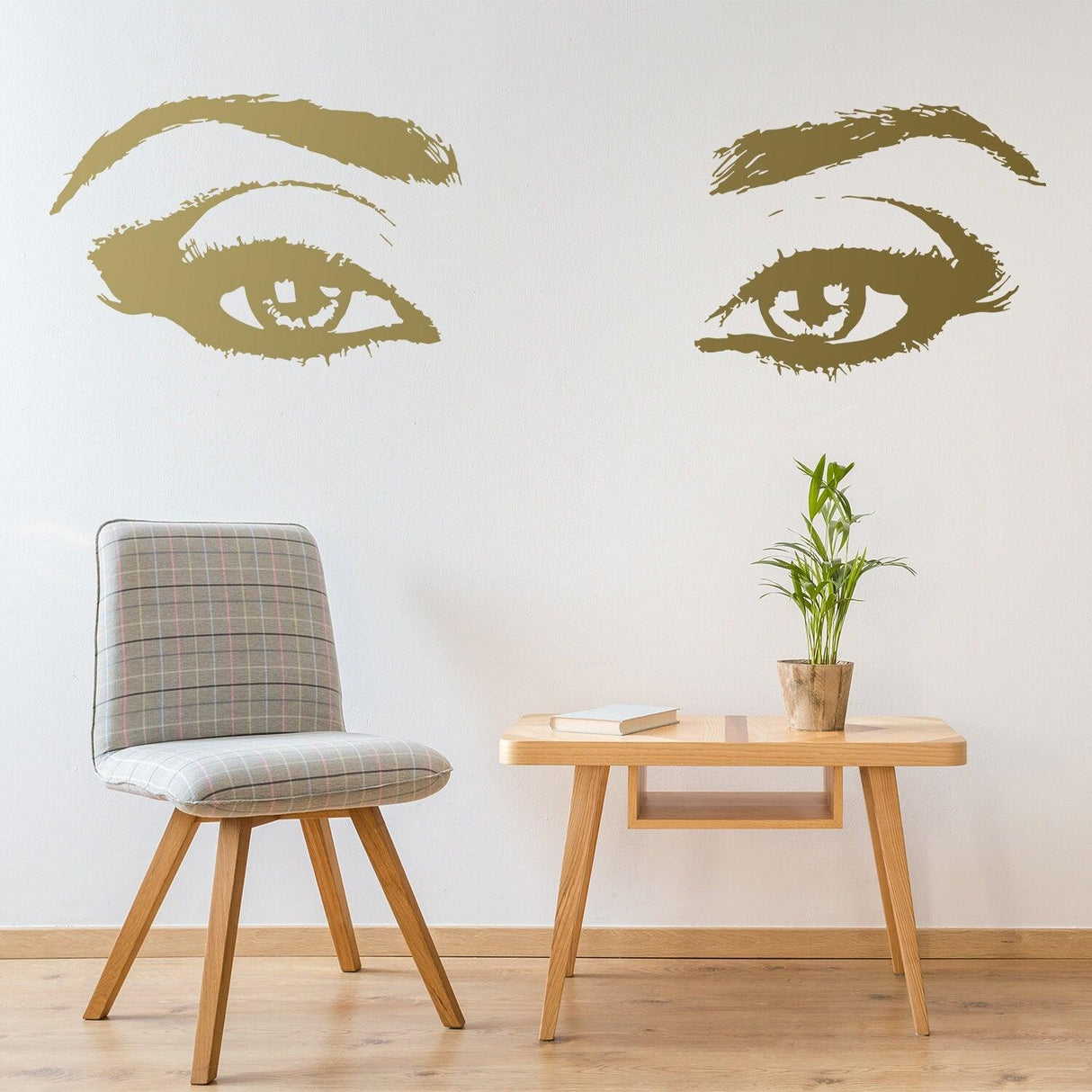 Woman eye vinyl wall sticker in elegant room with chair and plant, ideal for beauty salons and decor.