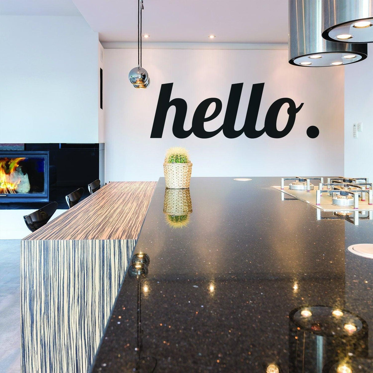 Elegant kitchen featuring a 'hello' vinyl wall sticker above a modern countertop.