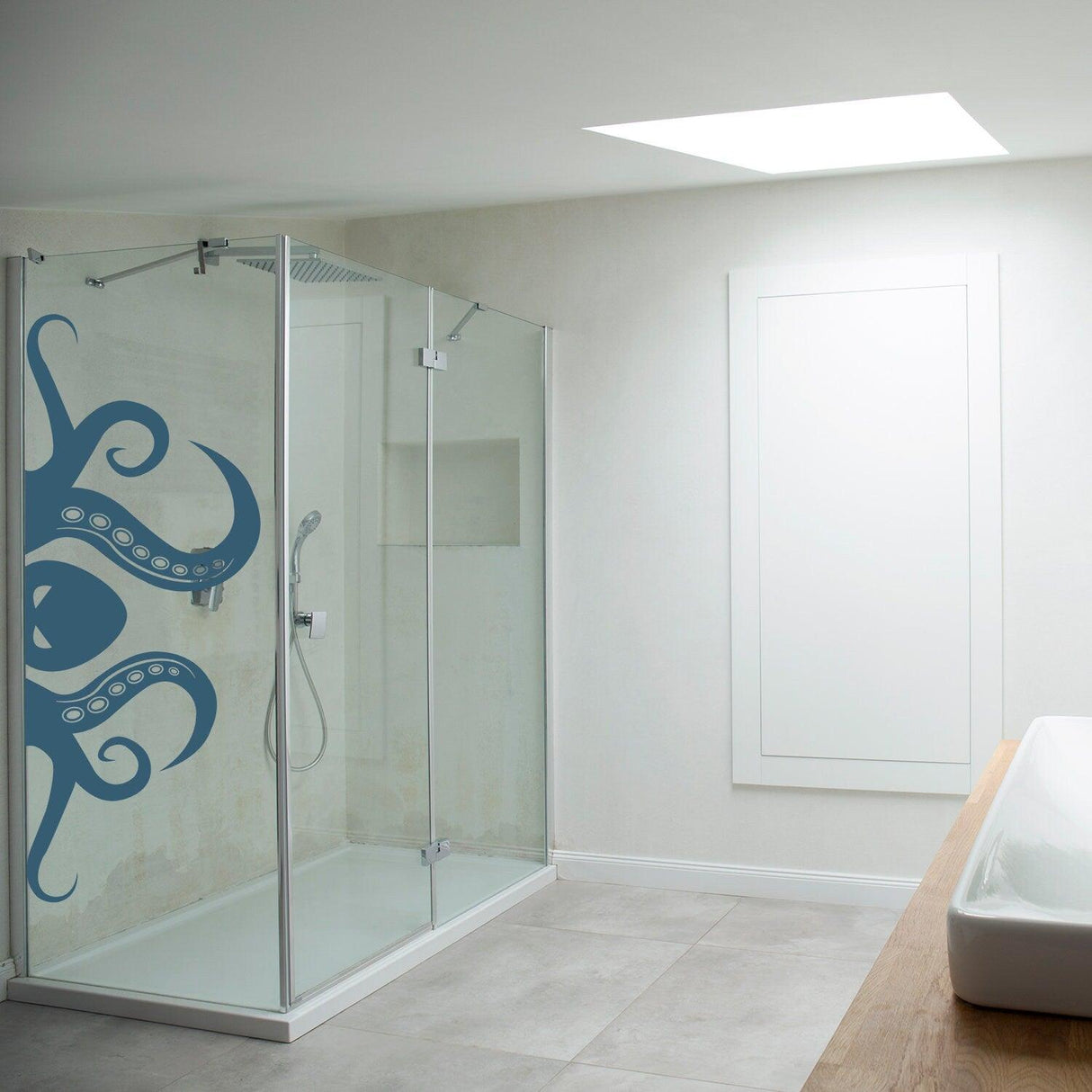 Octopus tentacle vinyl wall art sticker in a modern bathroom shower, adding whimsical ocean decor to the space.