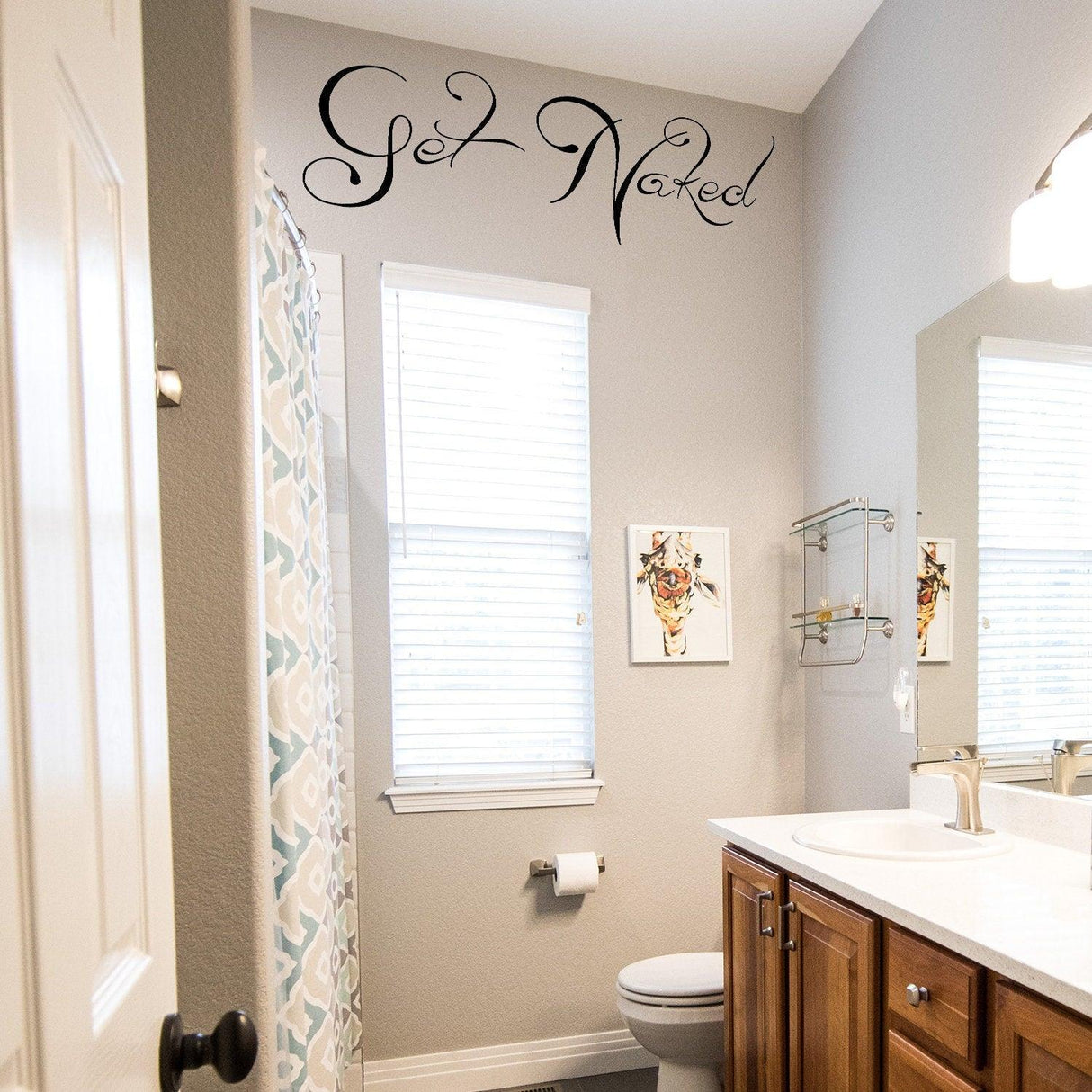 Get Naked wall bathroom sticker in a modern bathroom, adding fun and humor to the decor.