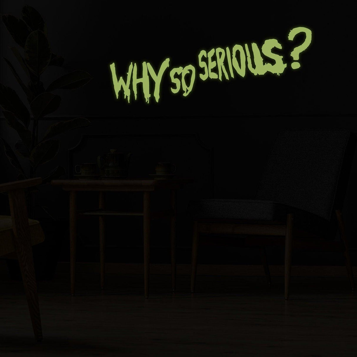 Glow in the dark wall vinyl sticker reading 'Why So Serious?' in a dimly lit room with modern decor.