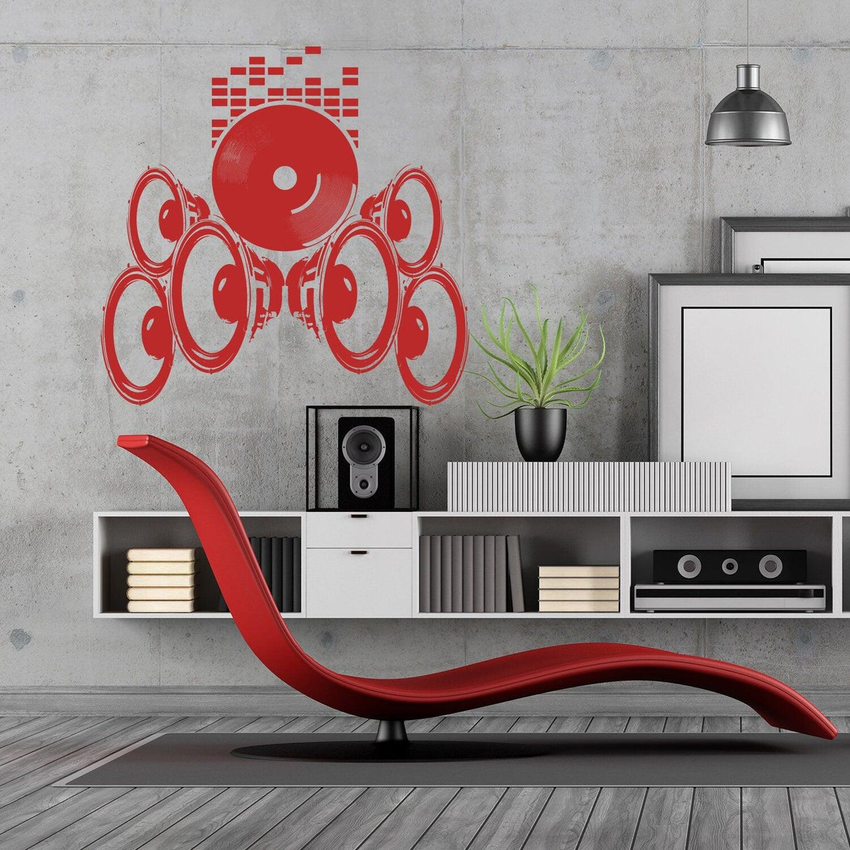Red vinyl music speakers wall sticker on a concrete wall in a modern living room, adding a creative touch to the decor.